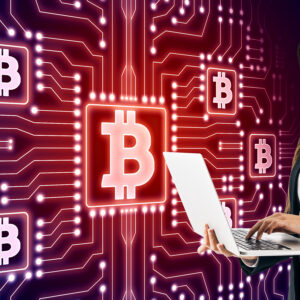 woman-using-laptop-with-bitcoin-technology-backgro-2026-03-26-04-46-26-utc