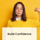 Confident professional speaking to a group during a team meeting, representing assertive communication and leadership skills.